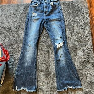 KanCan Blue Flare Jeans with Frayed Hem and Vintage Fading
